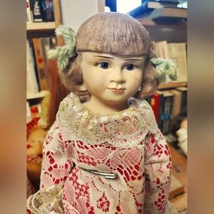 Vintage porcelain doll with Stand